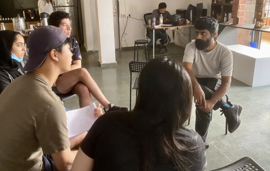 Students in conversation with Rajesh Prabhakar - a photo journalist in Dharavi