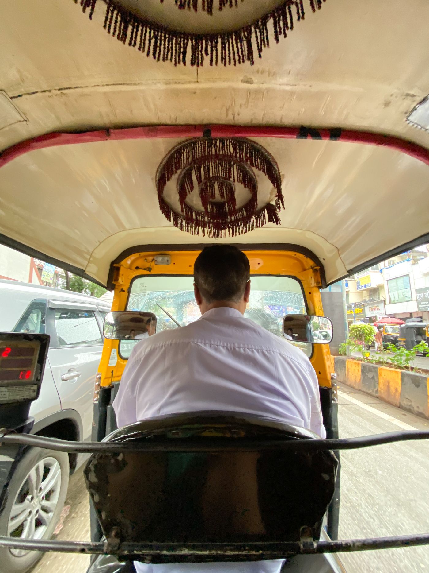 An autorickshaw with a fabric chandelier