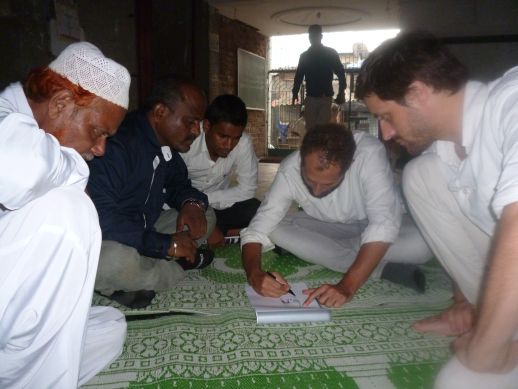 Masoom Moitra and Matias Echanovediscussing the design with the mosque committee.