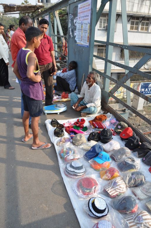 Mohammed H., 55, sells caps+has a weighing business on the side