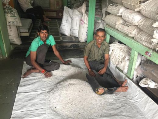 Workers from Dharavi's robust recycling industry. I would often chat to these same people as I walked to work, and here they are pictured to be filtering the plastics after the completing the 'shredding' process.