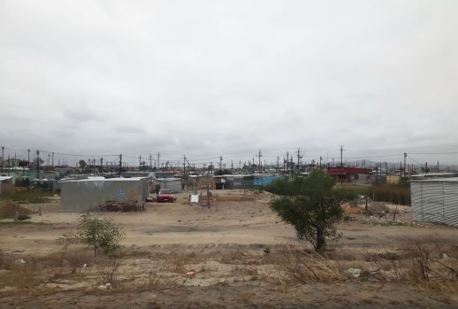 A view of a homegrown settlement in a low-lying area of Cape Flats