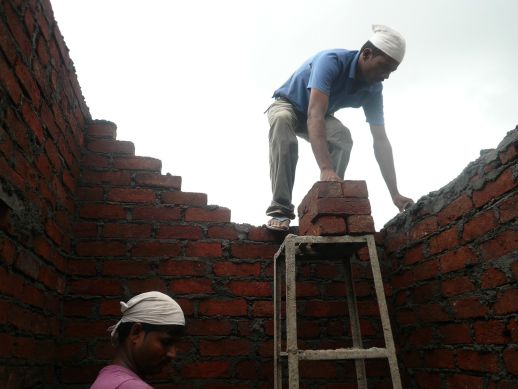Brickwork being laid on top floor of the documented house, Plot 22