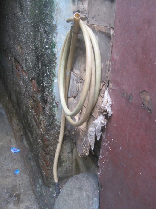 Reel of pipe used to bring water from a tap away from the house.