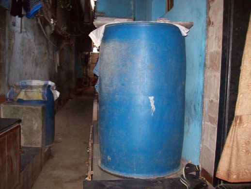 Storing water for washing and cleaning in water drums.