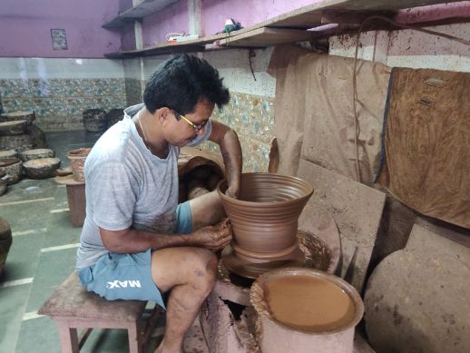 The pots are initially shaped on the wheel and subsequently refined in the moulds and left to dry.