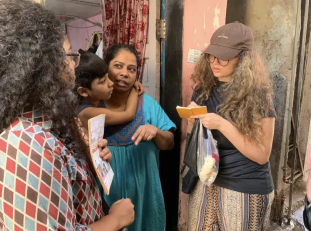  locals in the neighbourhood being interviewed by students