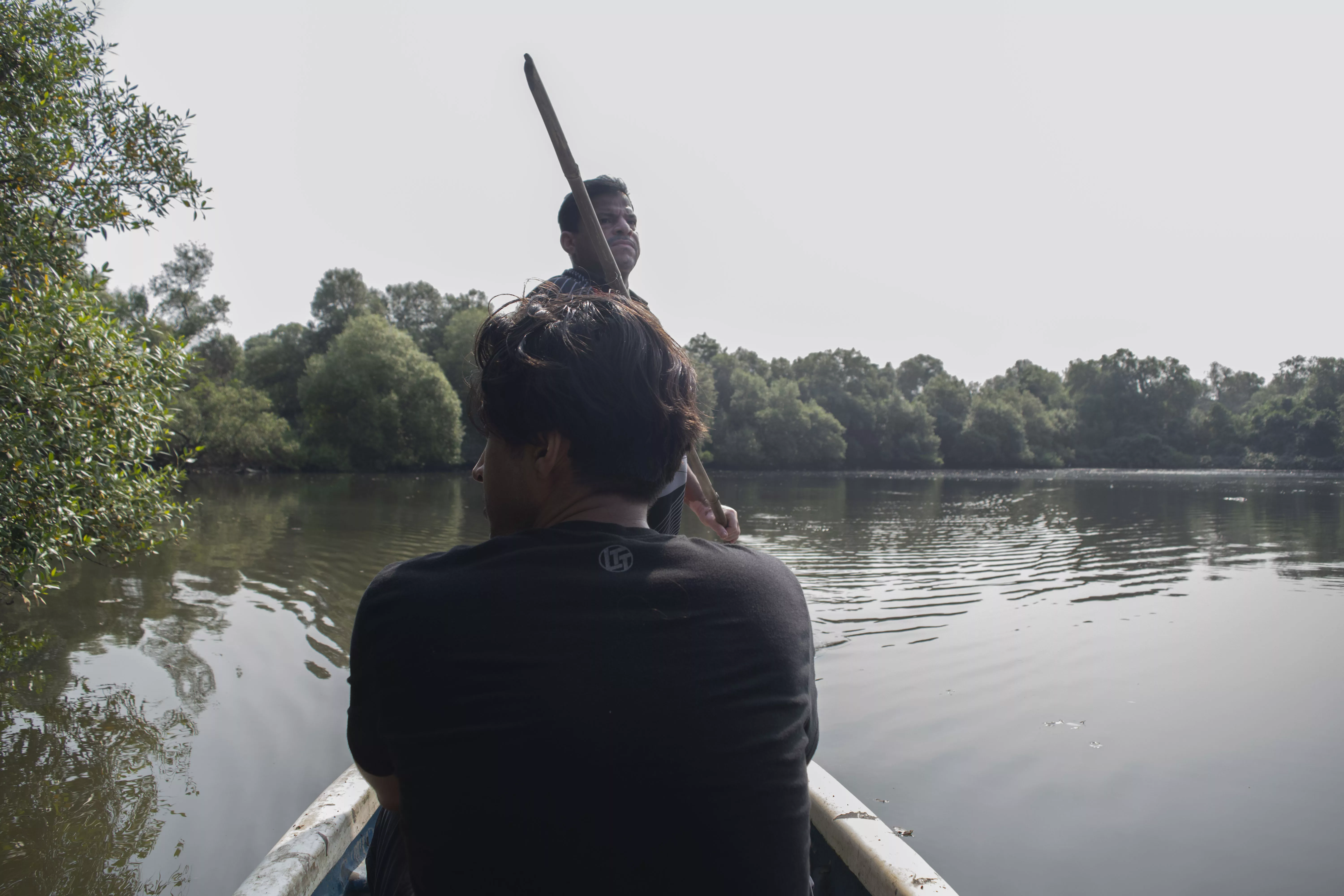 Wilson Koli takes students to his pond