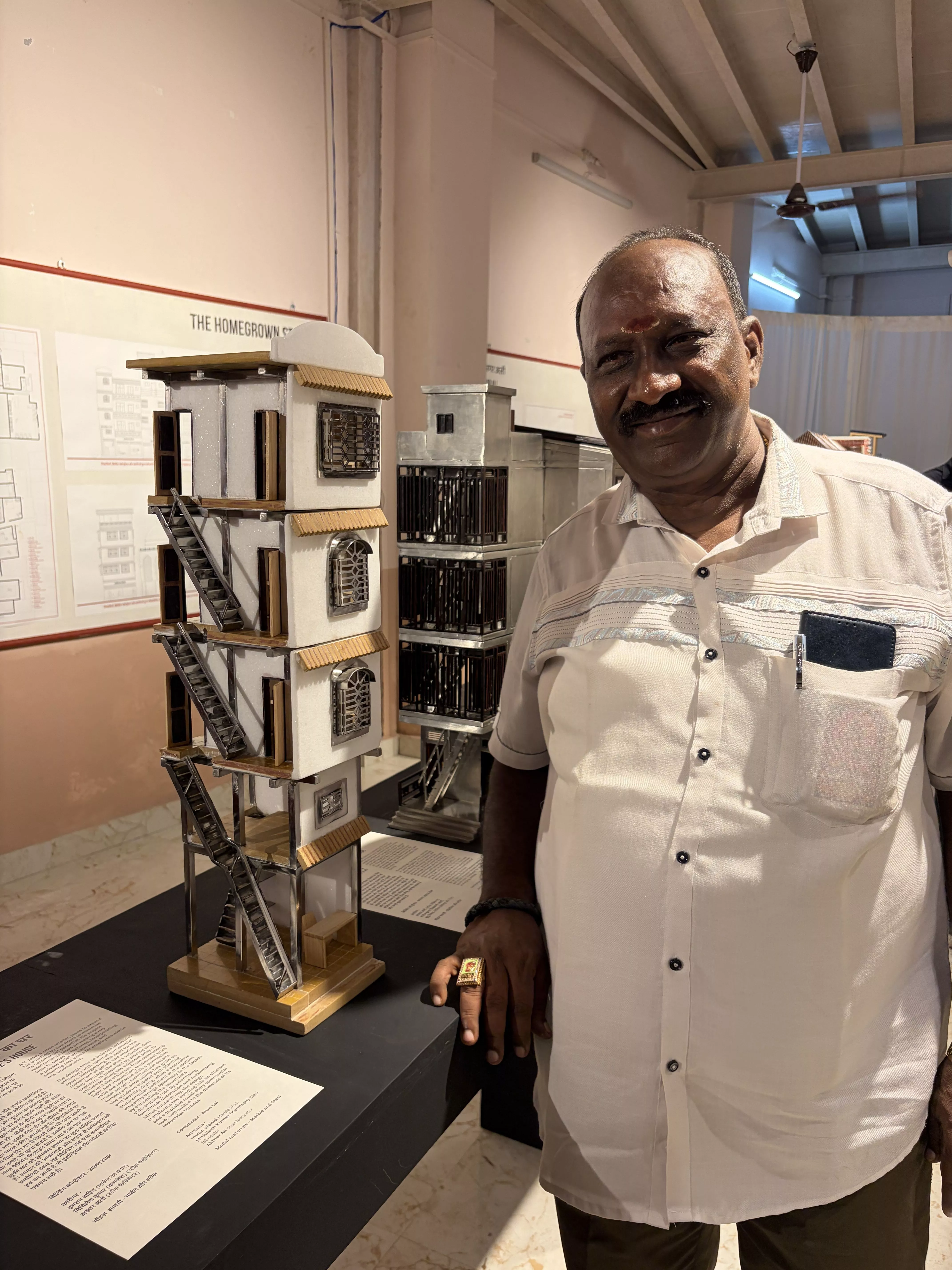 Arun Lal beaming next to his design