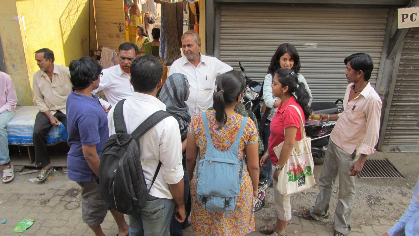 Left: Students interacting with contractor Chand Bhai in Shivaji Nagar, Deonar. 