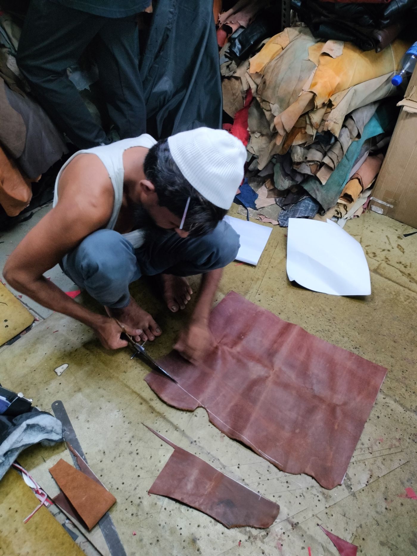 Khurshid cutting leather strips to size