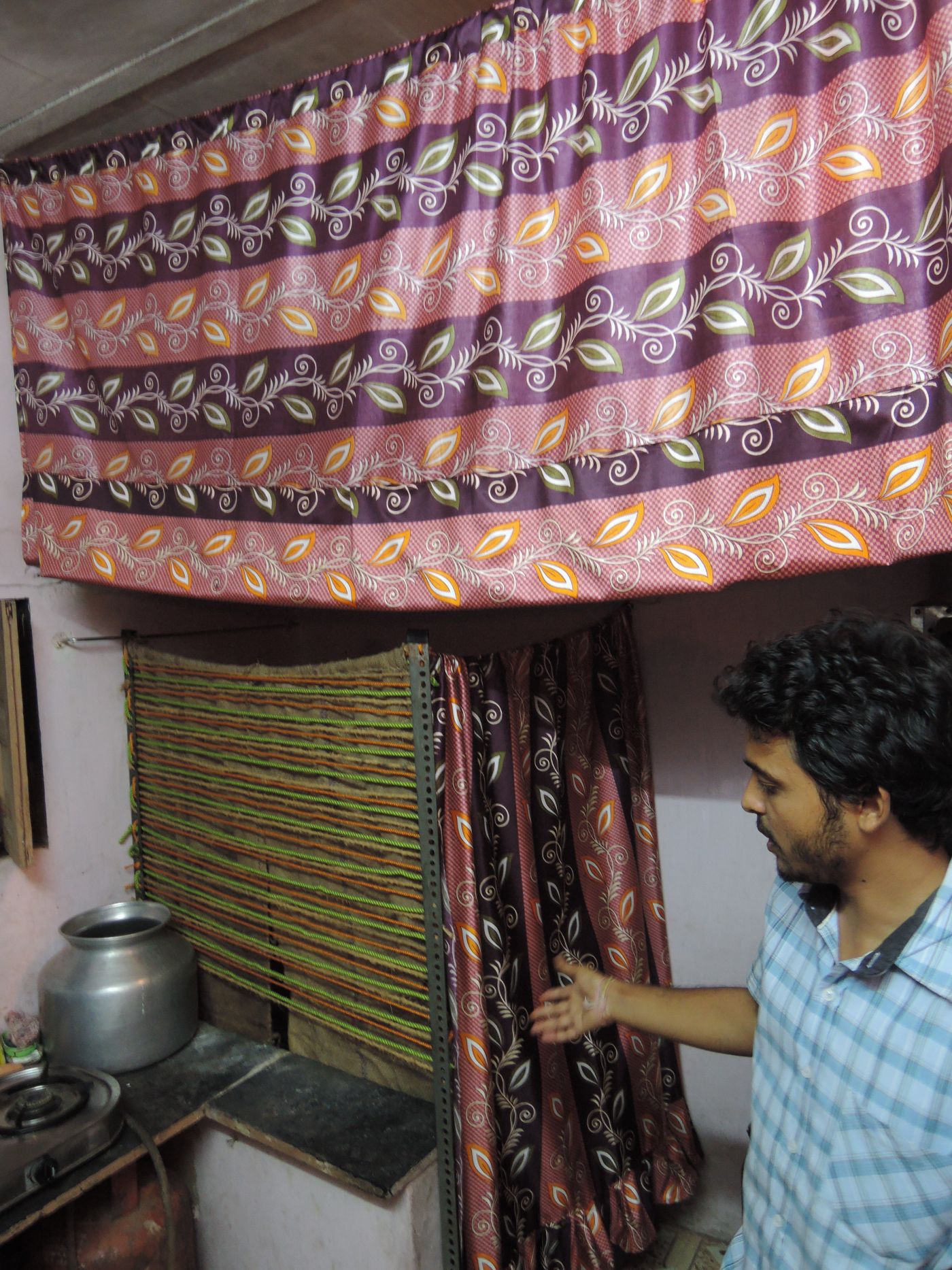Lavish Jain showing the simple partition system he made for a couple’s home.