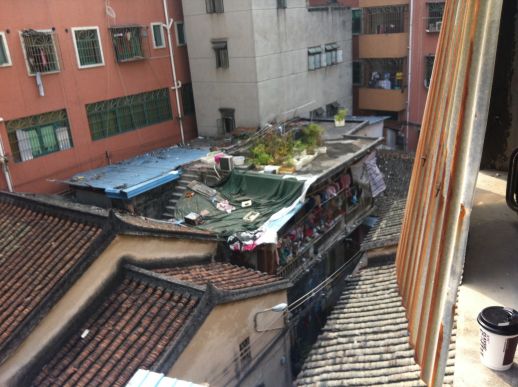 View from Ching’s house in ShiYan village. The photo clearly shows how the older, traditional looking houses have been extended and crowded by new buildings, which are now rising to multiple levels.