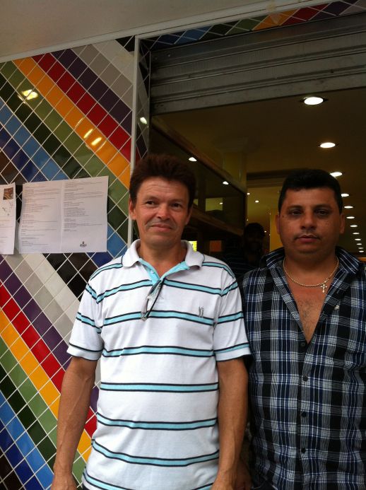 Pedreiro Ataide with market owner in front of the store. Trust and reputation is everything for a local builder.