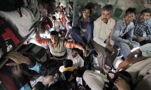  Passengers on a train in New Delhi, India. Photograph: Raj K Raj/Hindustan Times/Getty
