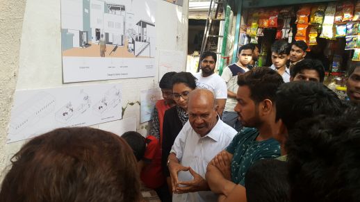 Life-long Dharavi resident and activist, Bhau Korde explaining some of the ideas developed by the urbz team to residents of Bareilly Compound.