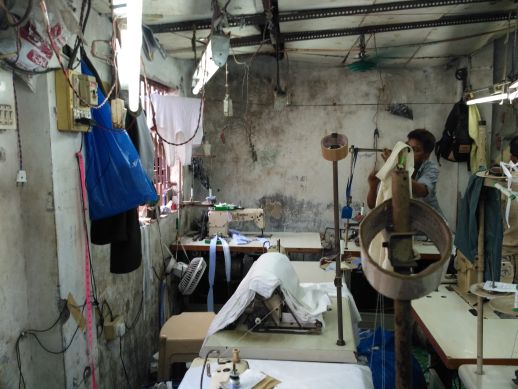 Sewing tables in Muzaffar's unit 