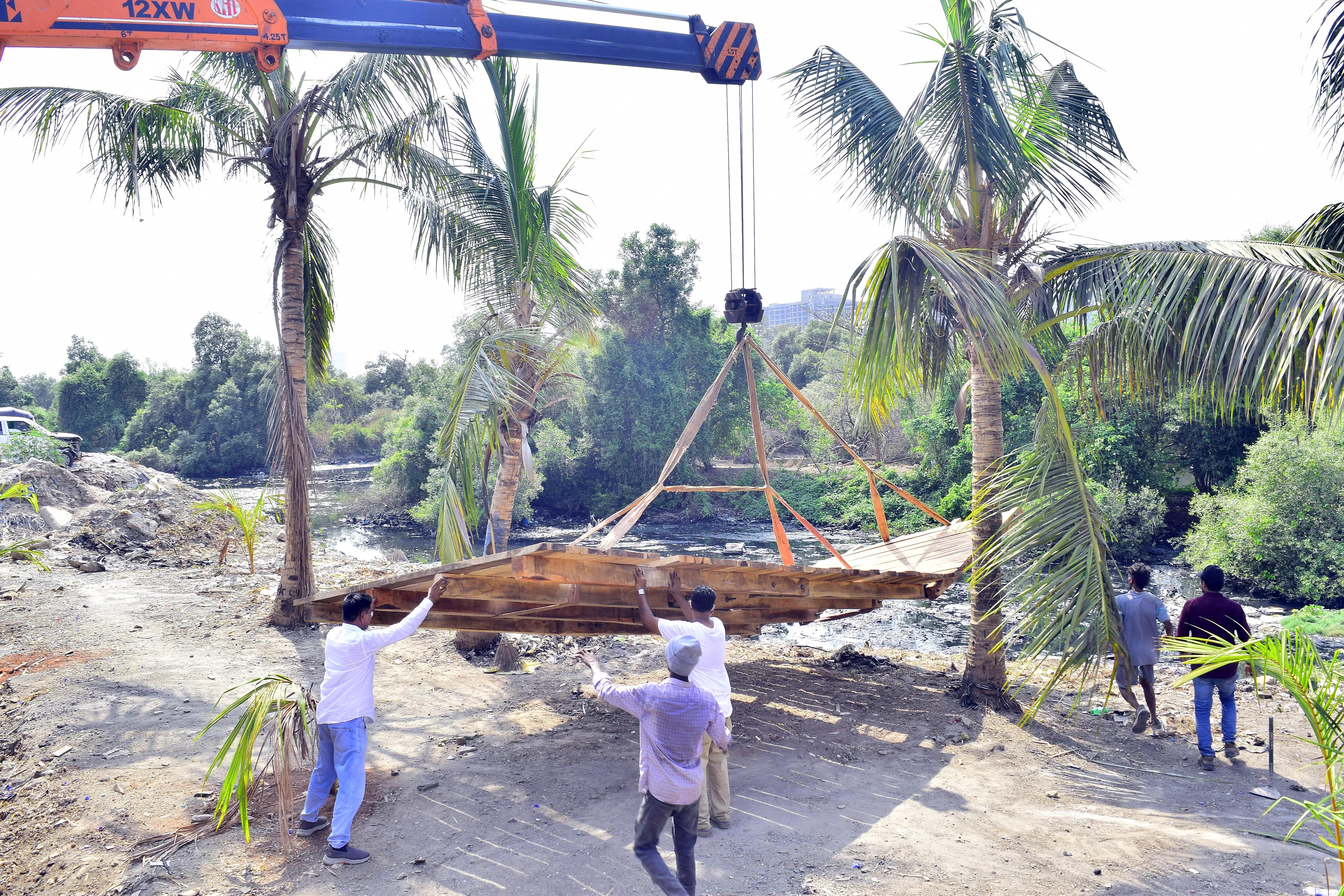 7. Deft maneuvers to correctly position the part jetty, part ramp on the edge of land and water