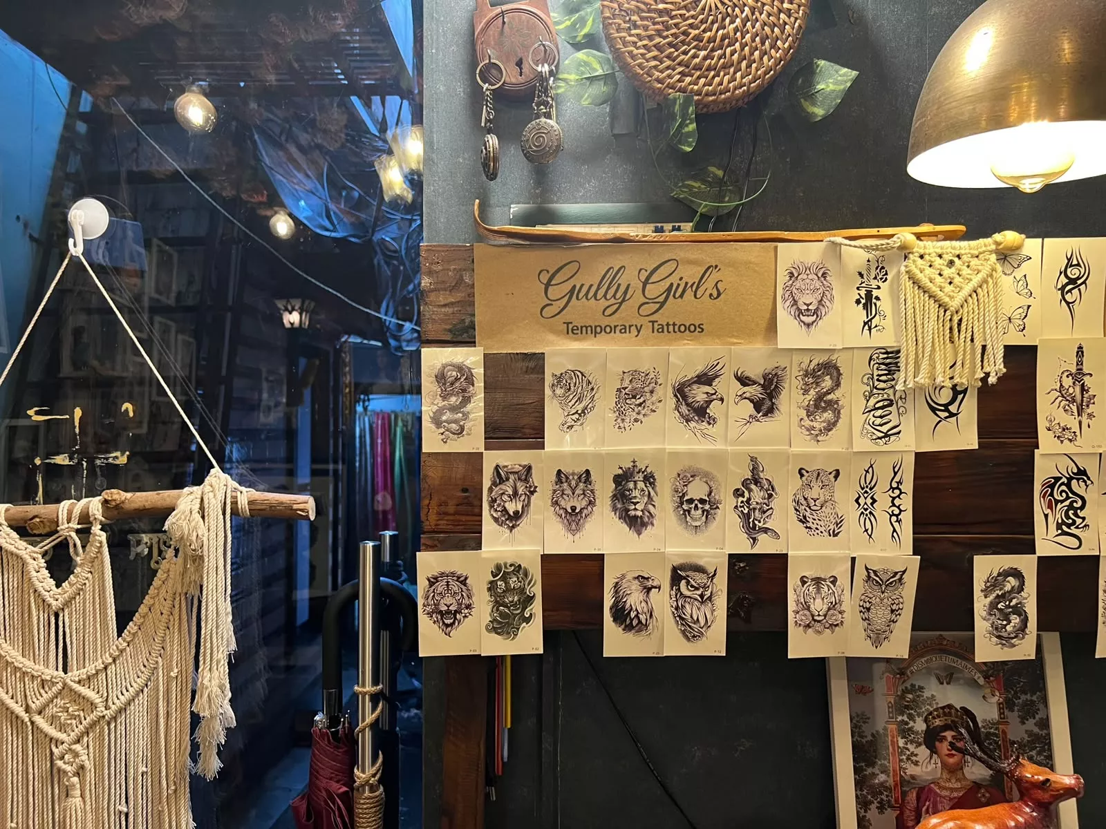 Hand drawn tattoo flashes hang on the wall for everyone to see.